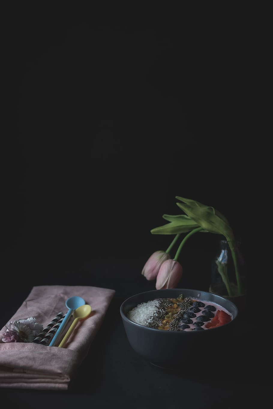 pink tulips in dim light, dessert in black bowl near two pink tulips HD wallpaper