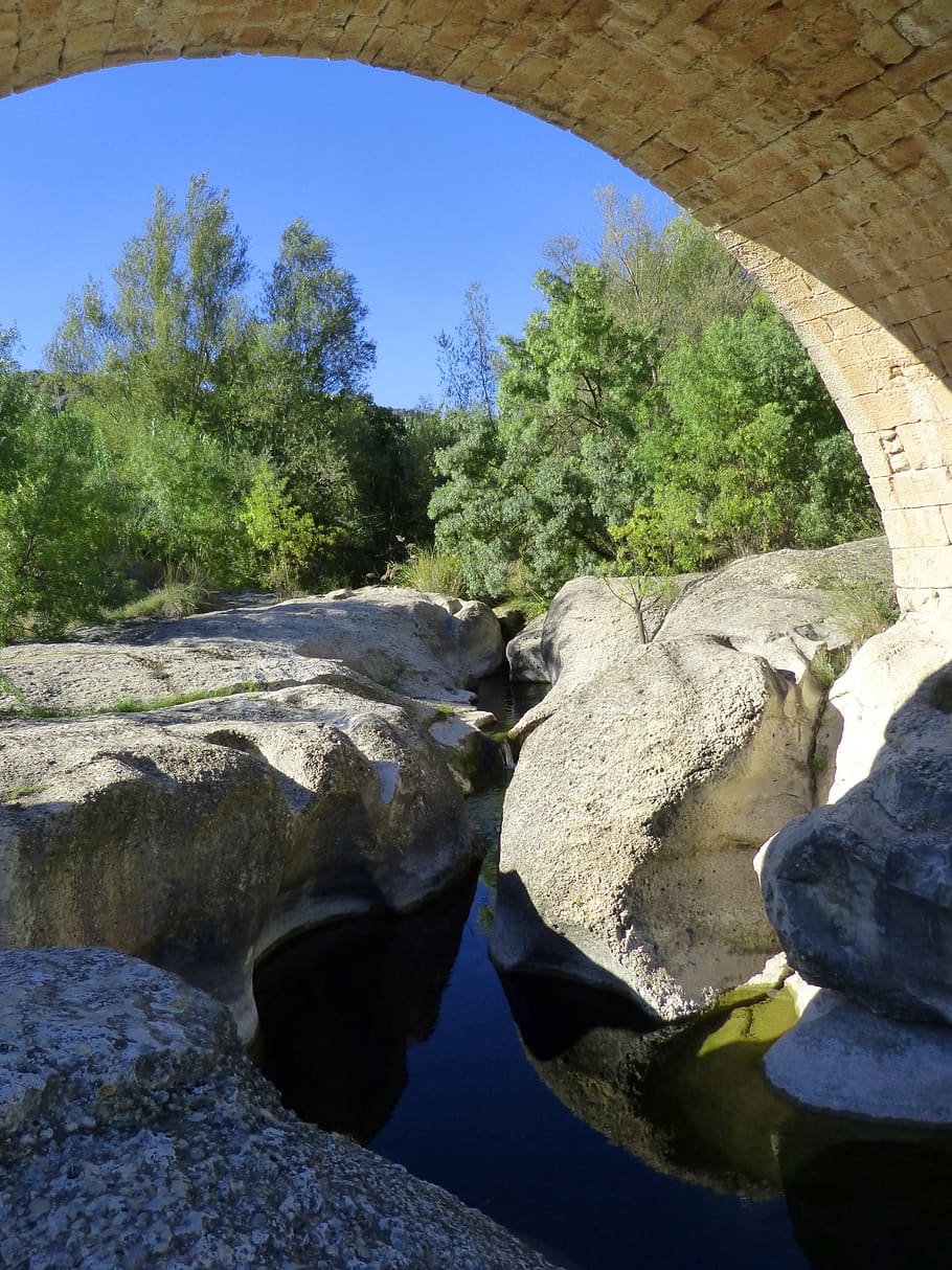 river, rocks, bridge, arc, reflection, landscape, plant, tree HD wallpaper