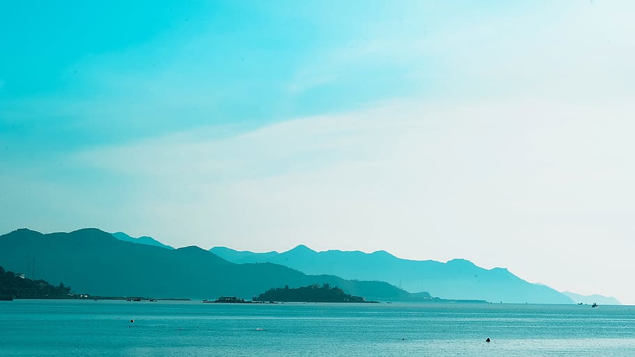 Silhouette of Mountain Near the Body of Water Photo in Daytime HD wallpaper