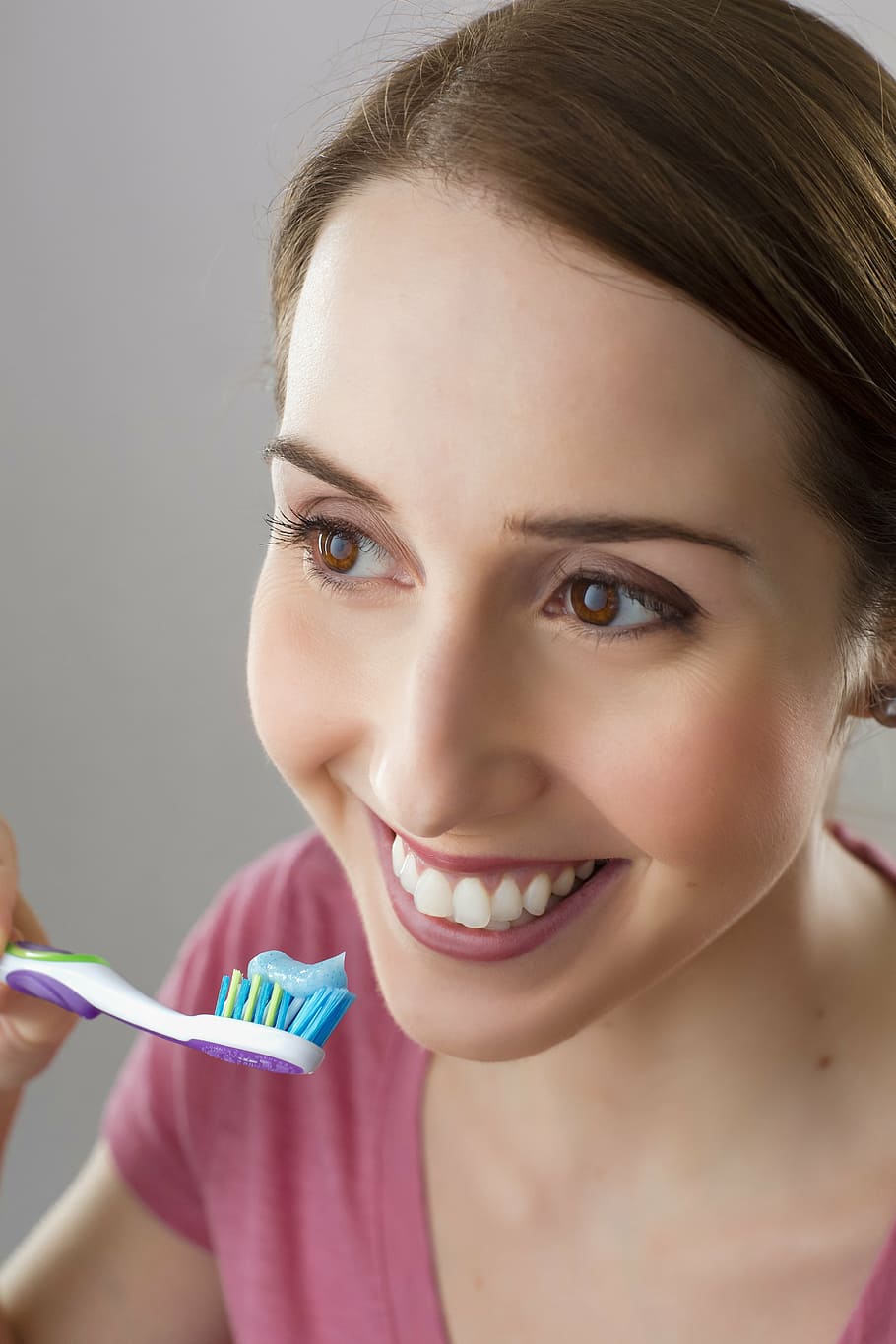 woman holding toothbrush while smiling, dentist, smile, hygiene, HD wallpaper