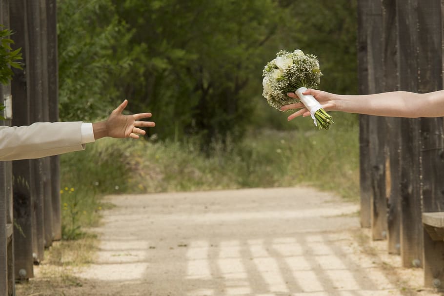 woman holding flower bouquet reaching man's hand, wedding, separation, HD wallpaper