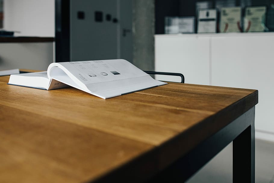 Tap catalogue on a wooden table, book, reading, faucet, manual, HD wallpaper