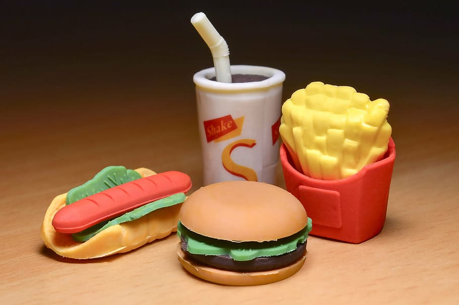 several fast food toys, chips, hamburger, junk food, plastic