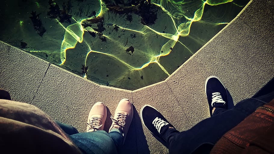 two person standing on ledge, body, water, shoe, footwear, pants