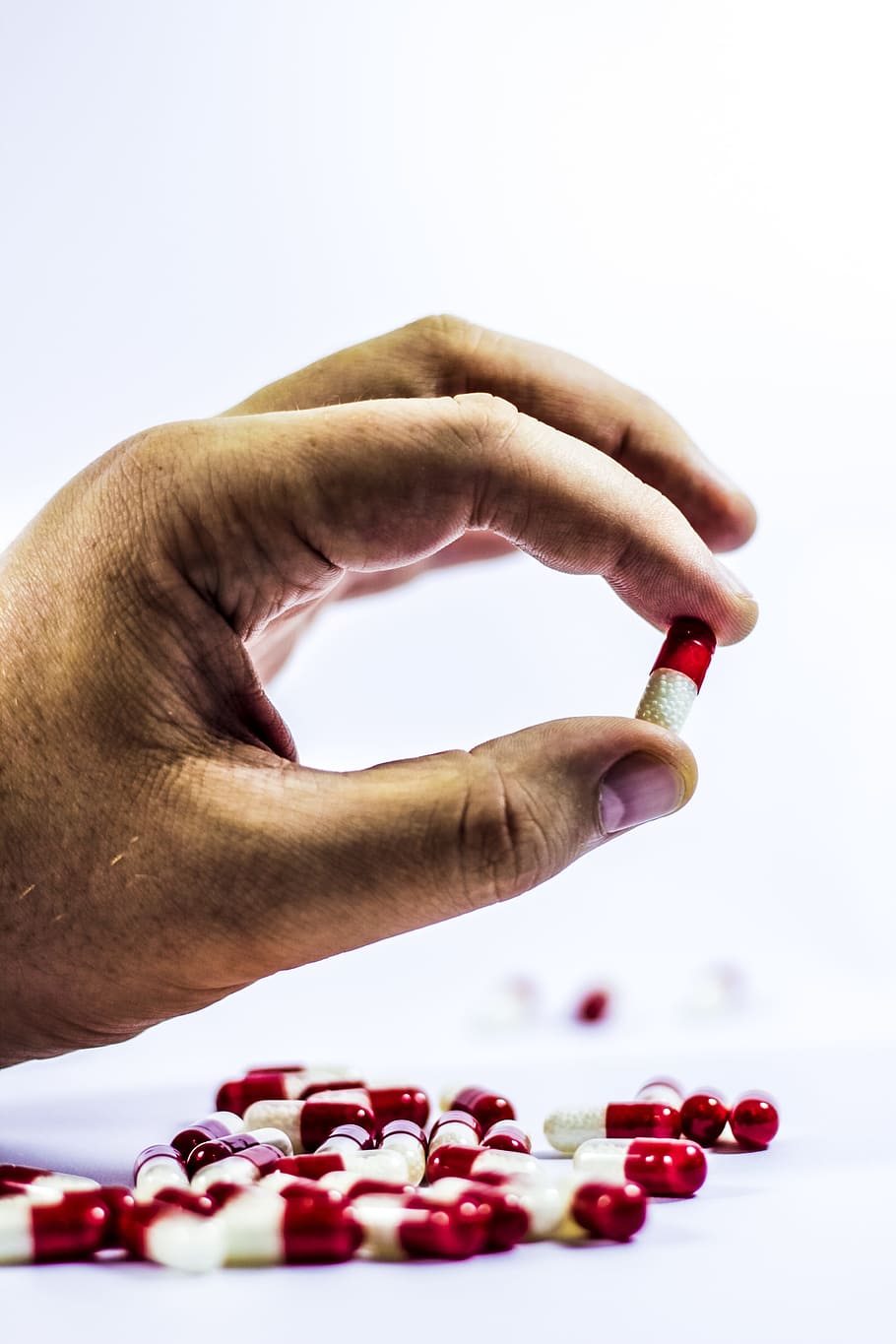 person holding medication capsule, cure, drug, cold, dose, the disease HD wallpaper