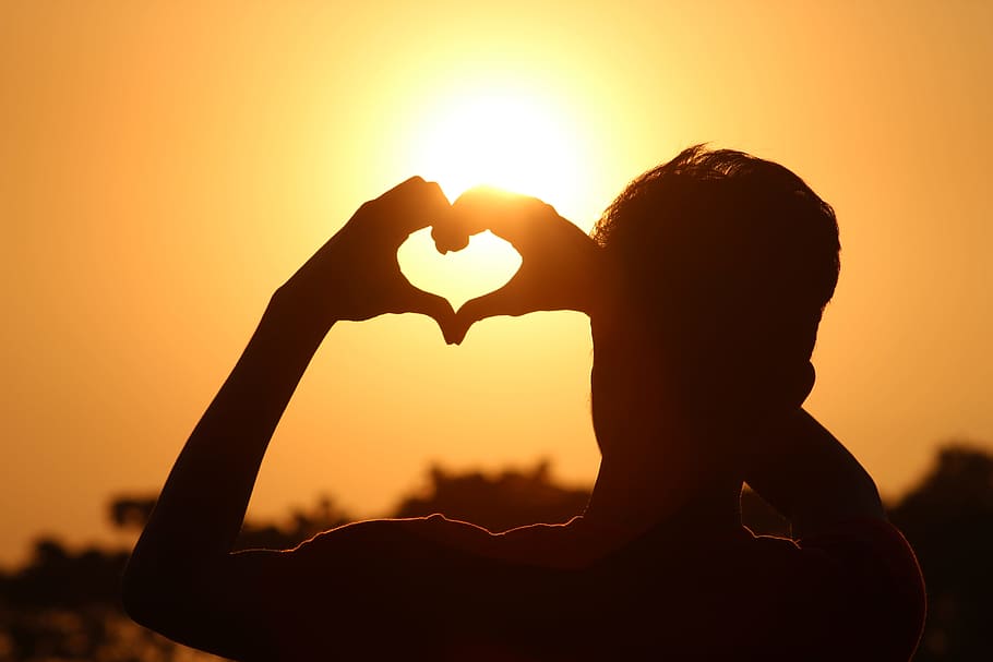 Silhouette Photo of Man Doing Heart Sign during Golden Hour, backlit HD wallpaper