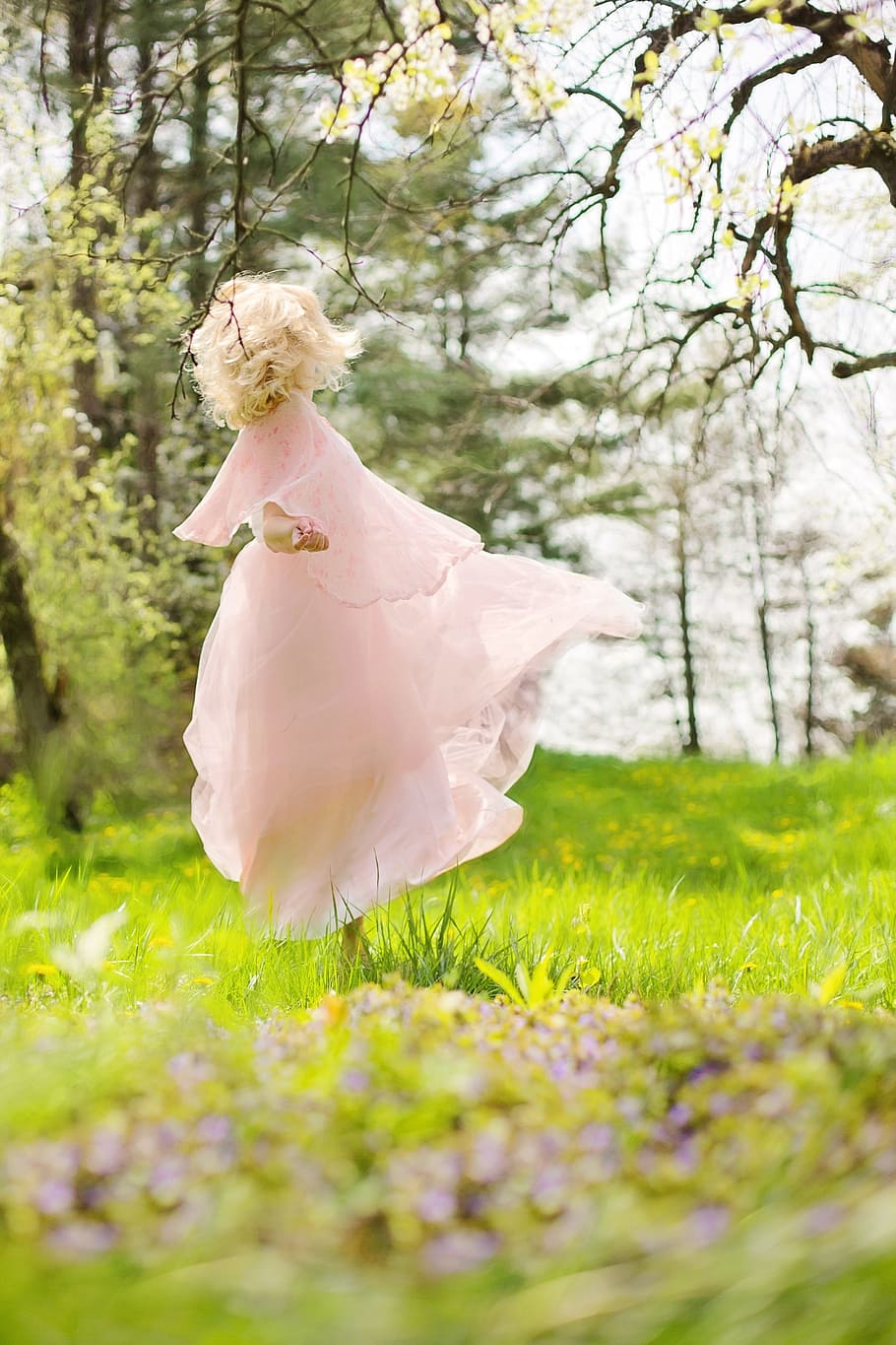 girl wearing pink dress, lovely woman, twirling, dancing, happy
