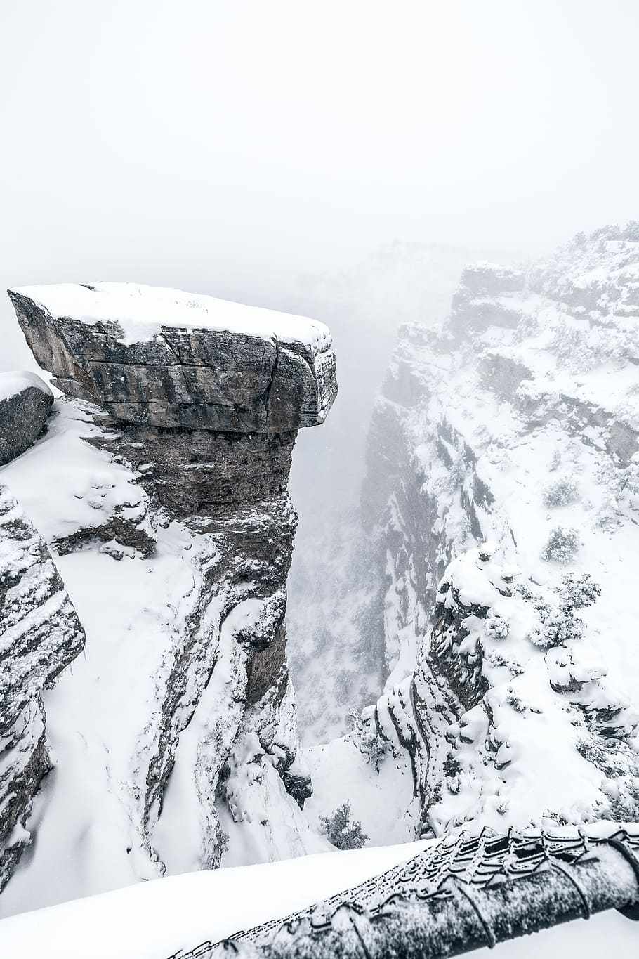 HD wallpaper: snowy cliff under foggy sky, mountain during winter ...