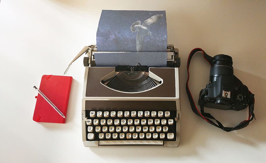 typewriter beside DSLR camera, imagination, bird, universe HD wallpaper