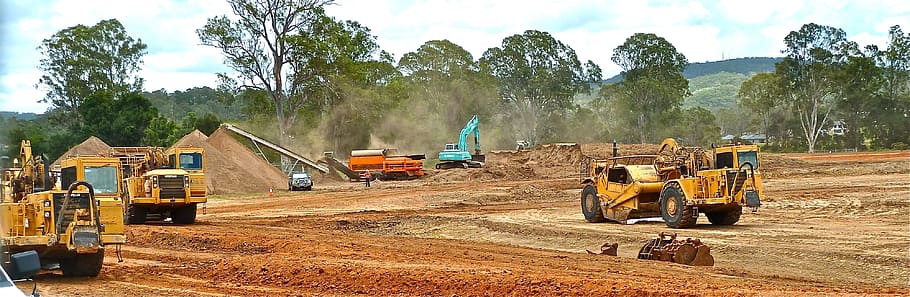 yellow heavy equipment on brown field, daytime, bulldozer, crawler, HD wallpaper