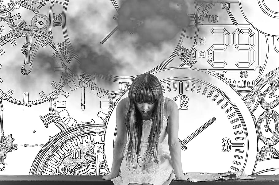 grayscale photo of woman in dress with clocks as background, girl