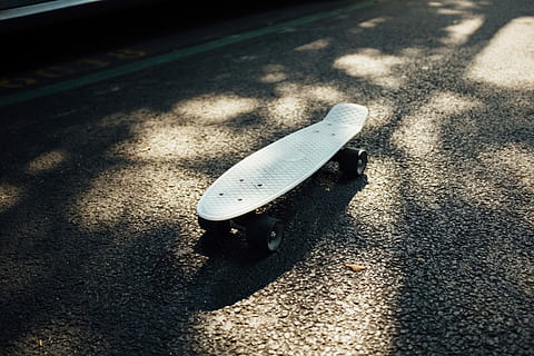 gray longboard on gray asphalt road, white Penny cruiser board on road HD wallpaper