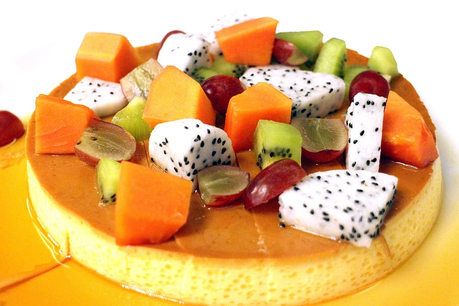 sliced kiwi, papaya, grape, and dragon fruit topped caramel flan HD wallpaper