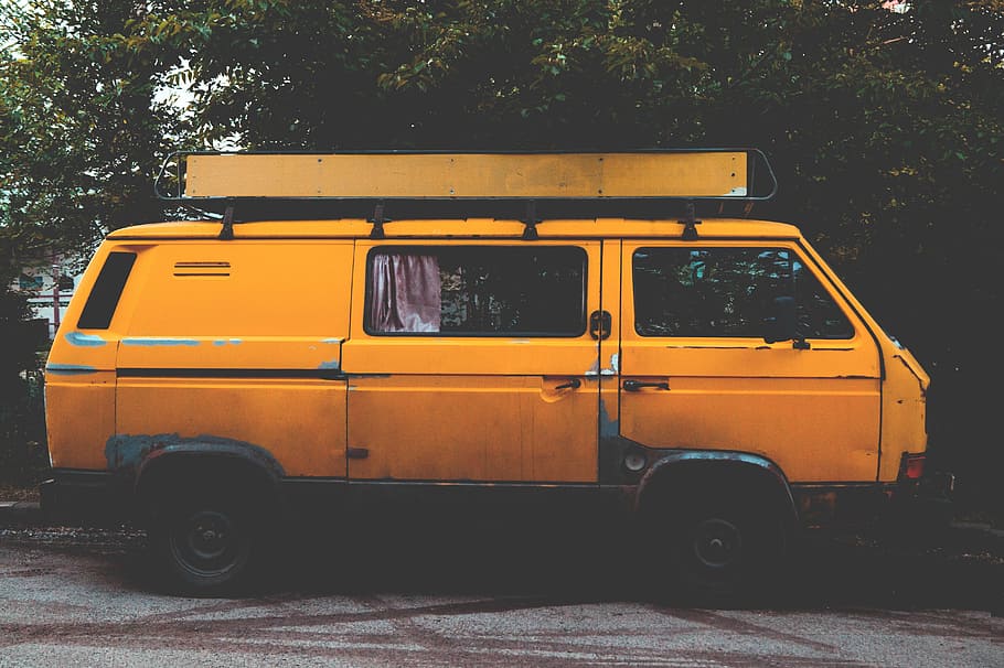 yellow panel van parked near green leafed trees, selective focus of van at daytime HD wallpaper