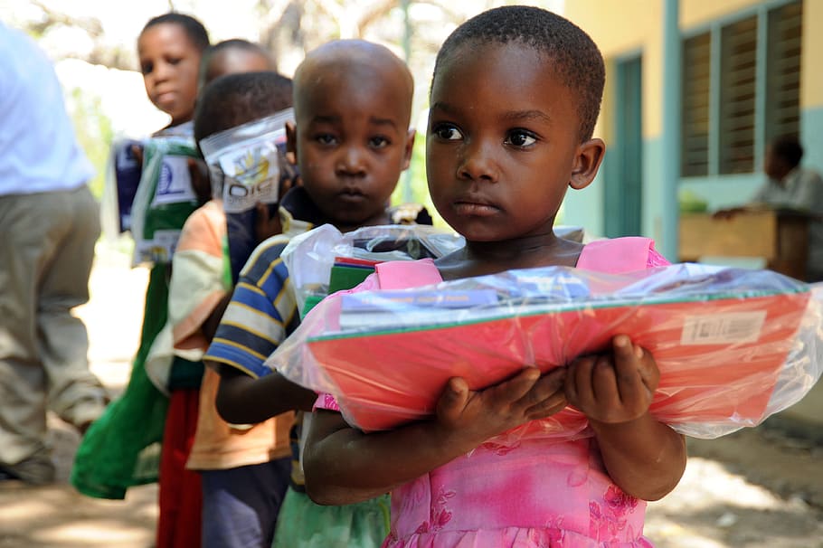 children holding school supply packs, tanga, tanzania, care packets, HD wallpaper