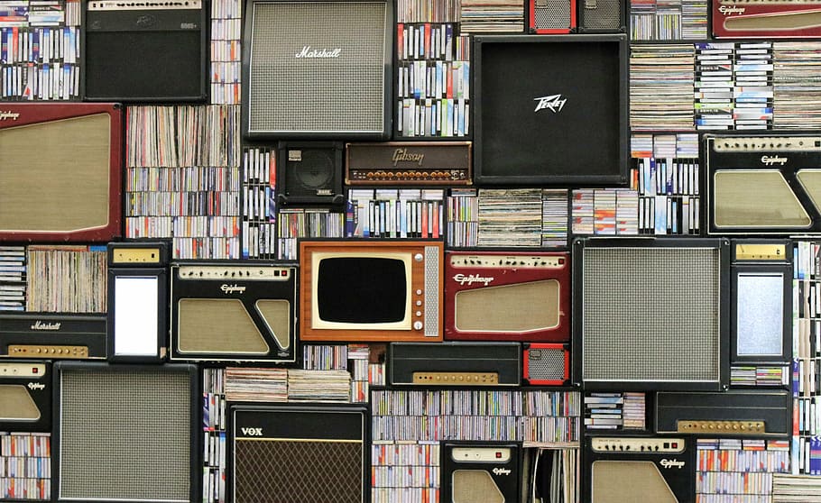 assorted-title book lot and assorted-brand amplifier lot, speaker HD wallpaper