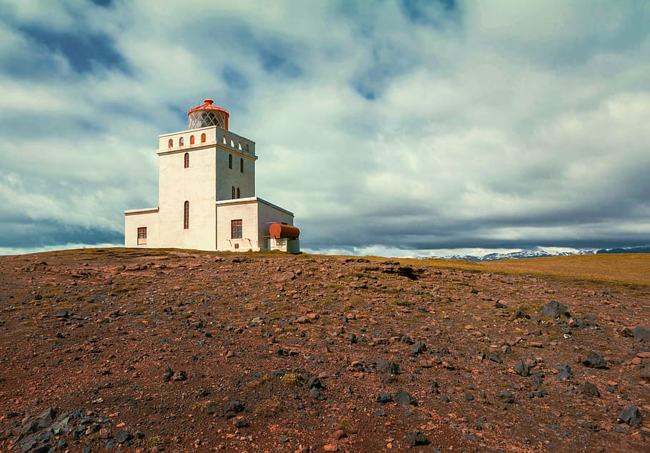 white painted building near body of water, lighthouse, steinig HD wallpaper