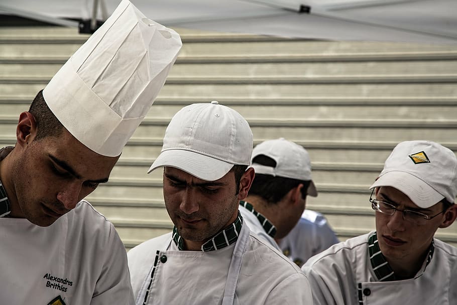 four men wearing white chef uniform inside room, human, chefs HD wallpaper