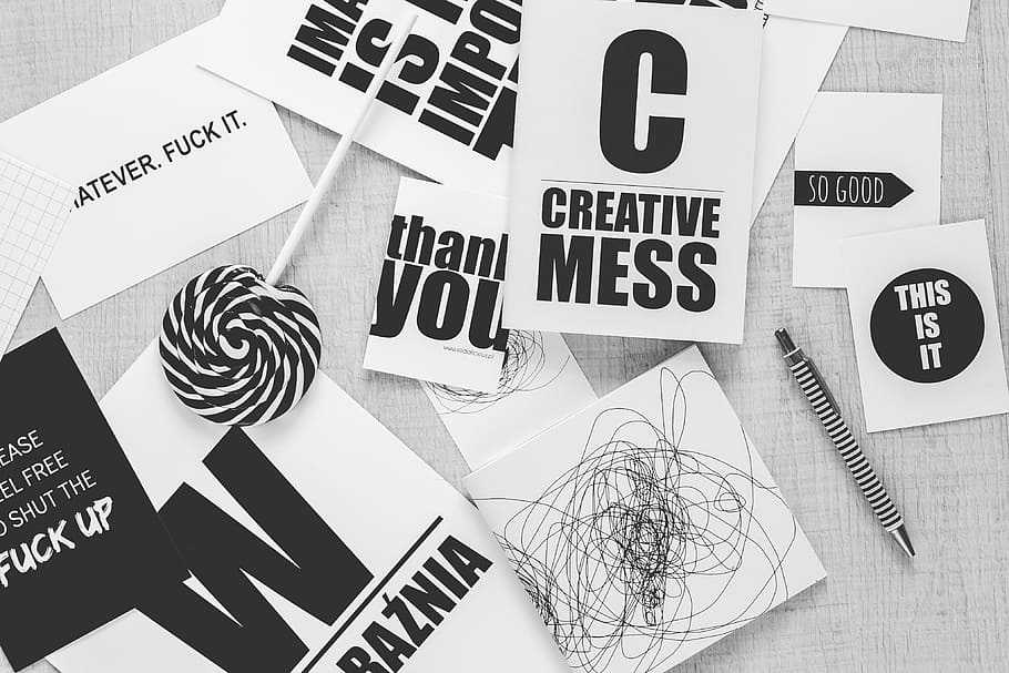 photo of Creative mess paper beside pen and lollipop, typography HD wallpaper