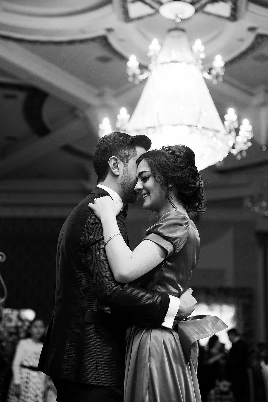 greyscale photography of dancing couple, gray, chandelier, people