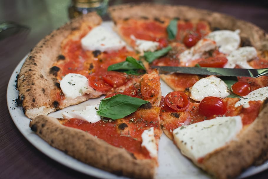 slice pizza with tomato and white cheese on top dish, margherita pizza