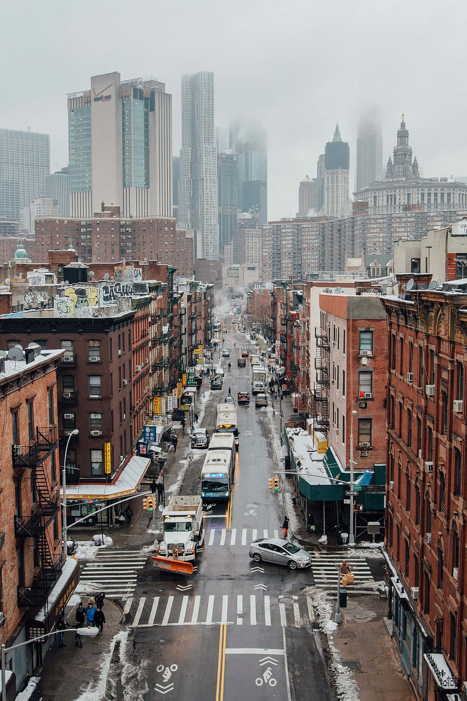 aerial photo of cityscape during daytime, vehicles traveling on road near buildings HD wallpaper
