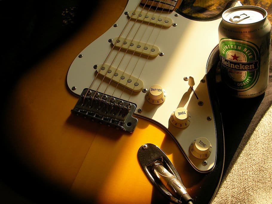 electric guitar beside Heineken can, stratocaster, beer, musical instrument