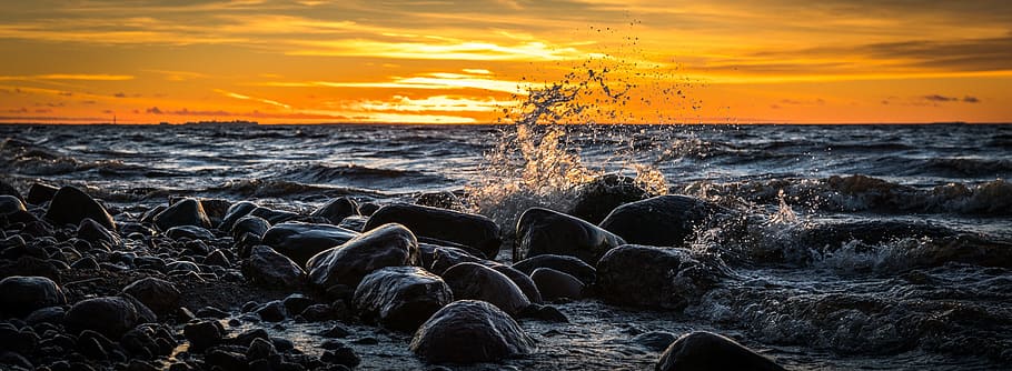 waves splashing through rocks during golden hour, sunset, water HD wallpaper