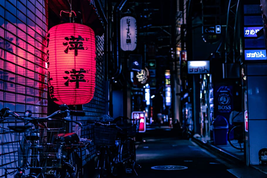 Japanese lantern over city bike at nighttime, red and black paper lantern