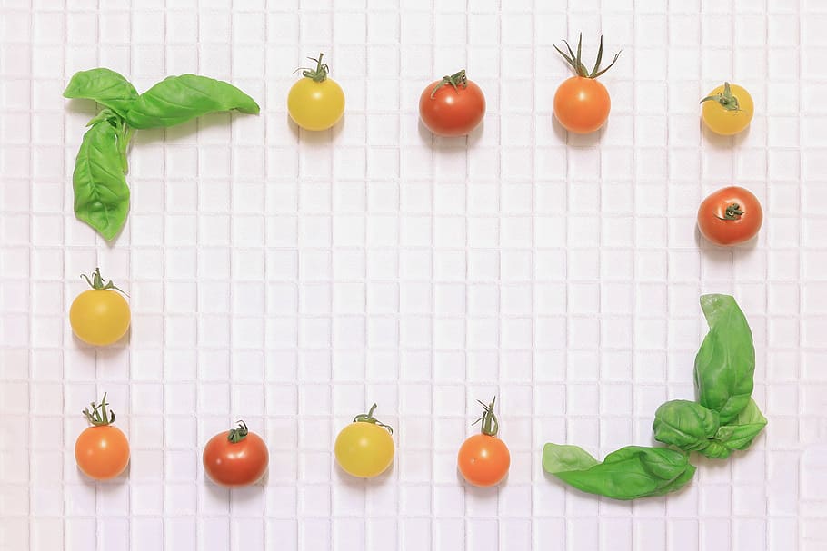 fruit and vegetable photography of tomatoes and green leaves HD wallpaper