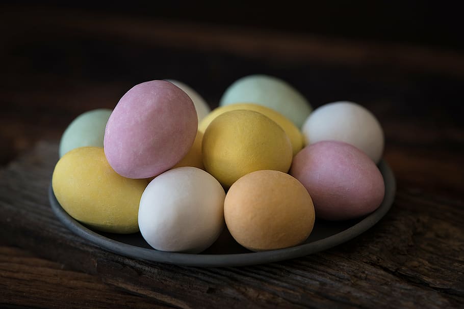 assorted-color eggs on grey plate, chocolate eggs, eggs with frosting HD wallpaper