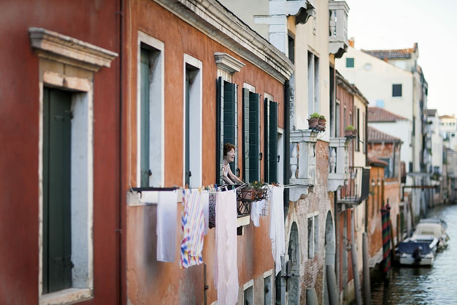person looking outside window during daytime, woman looking outside from building terrace HD wallpaper