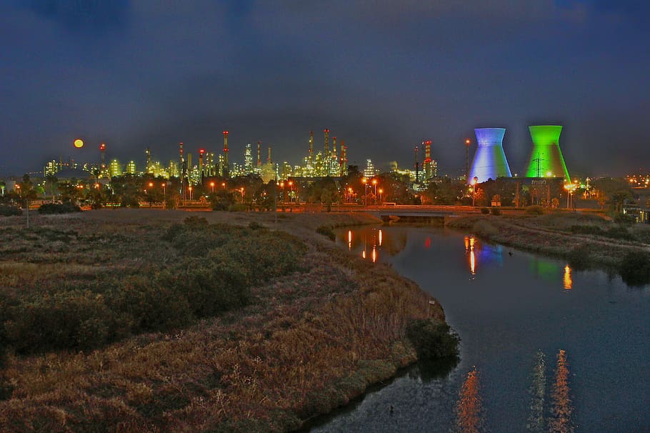 high-rise building at distance, refineries, haifa israel, night HD wallpaper