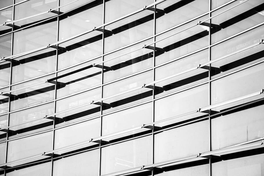 grayscale photo of building, photo of clear glass windows building during daytime HD wallpaper
