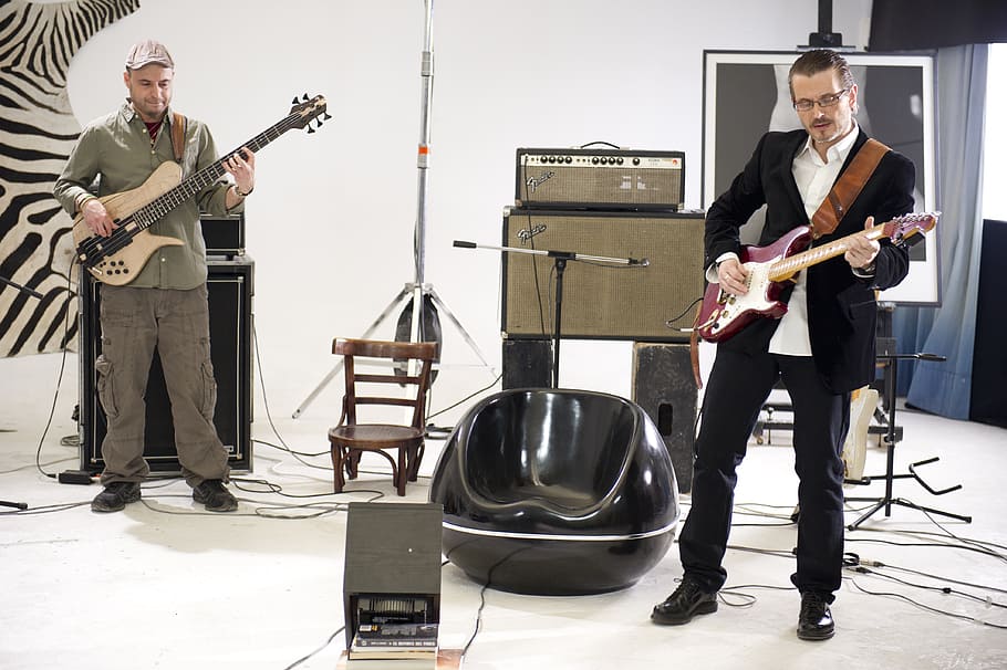 two men each playing electric guitar and electric bass guitar HD wallpaper