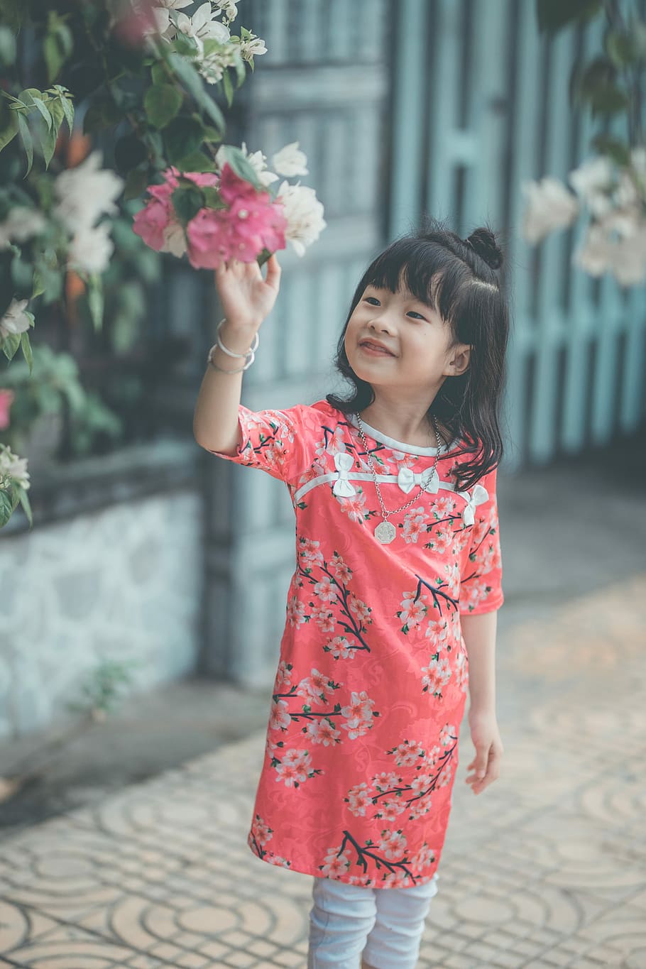 girl standing about to touch flower, girl picking flowers, one person HD wallpaper