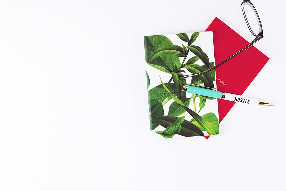 teal click pen on white surface, click pen on floral book, notebook HD wallpaper