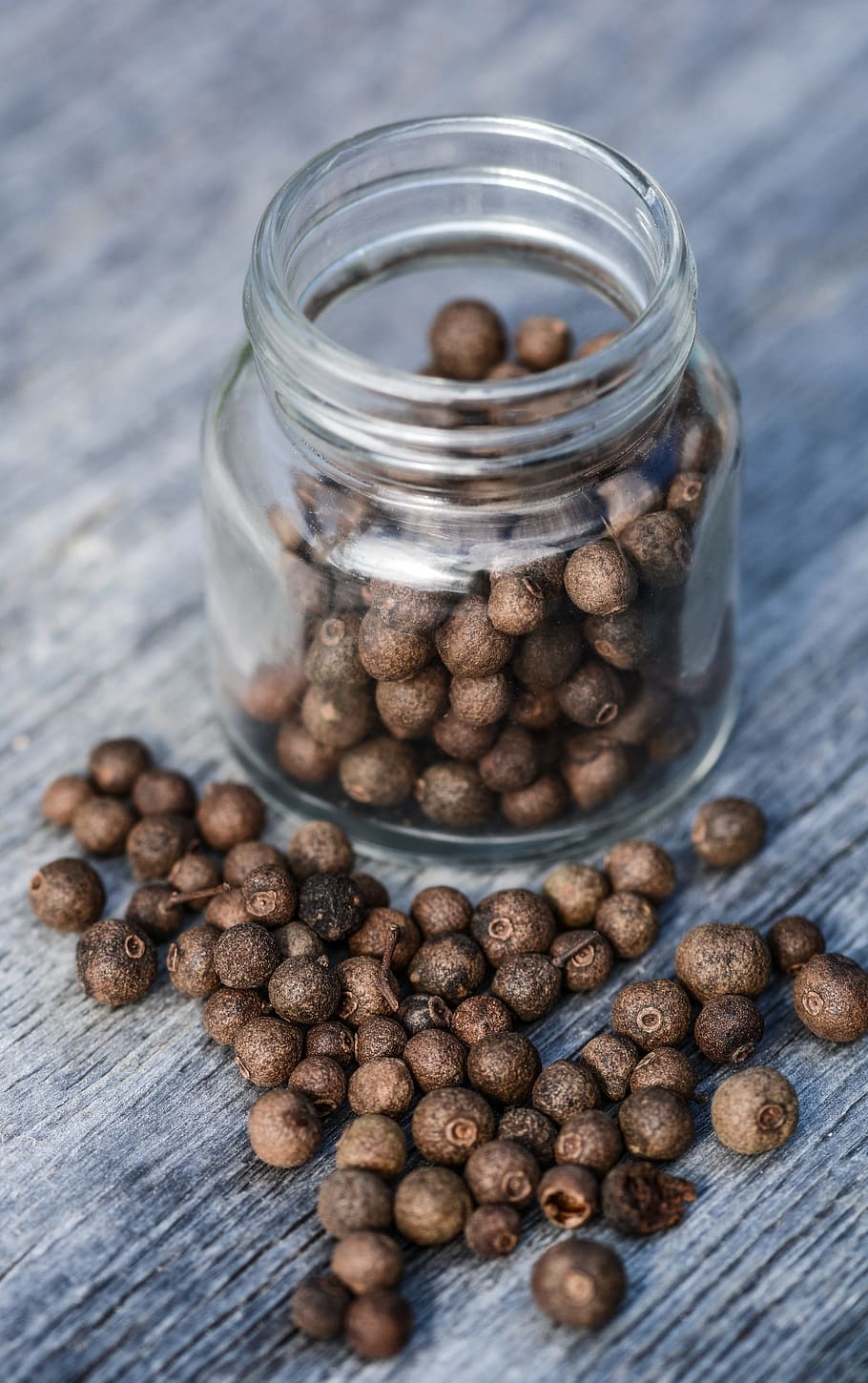 brown seeds inside clear glass jar on gray plank, spices, kitchen HD wallpaper