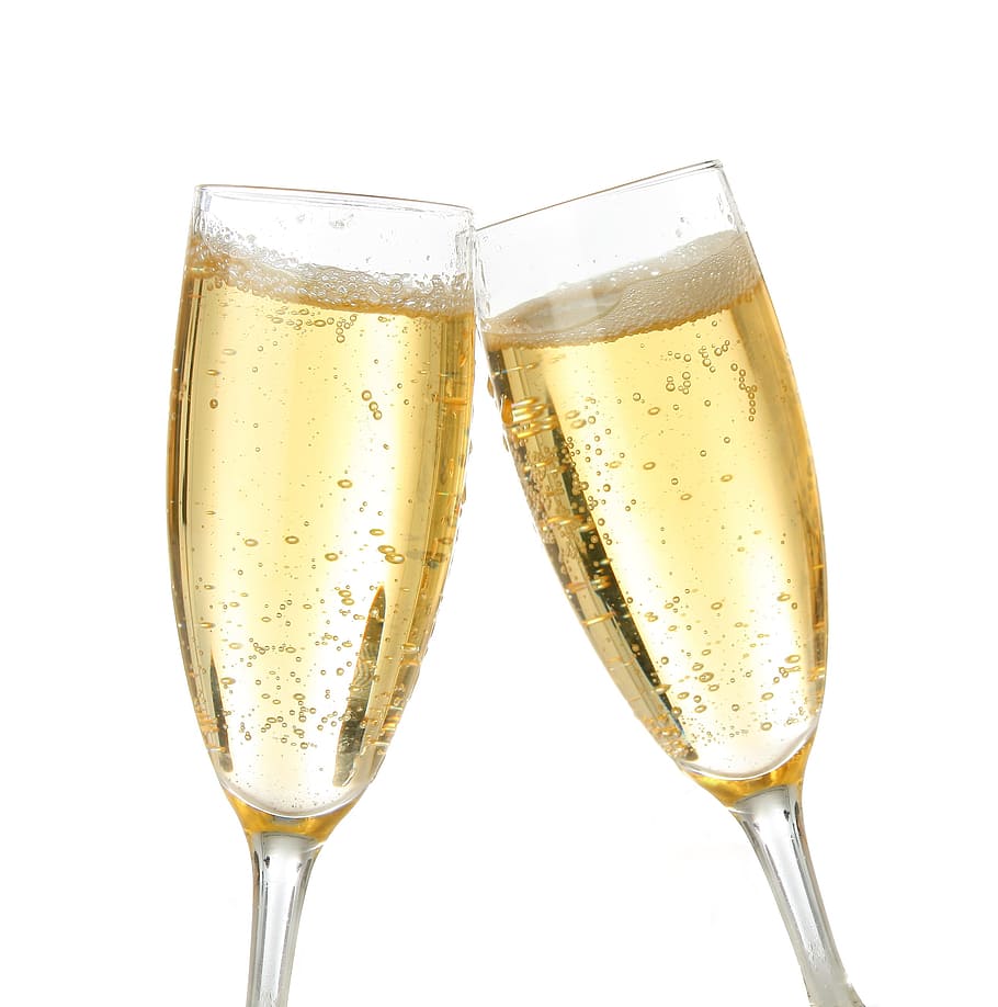 two clear champagne glasses with champagne, brindisi, white background