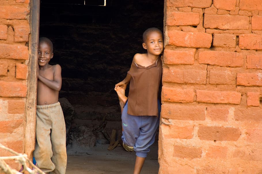 two boys on doorway, kenya, africa, children, cute, smiling, standing