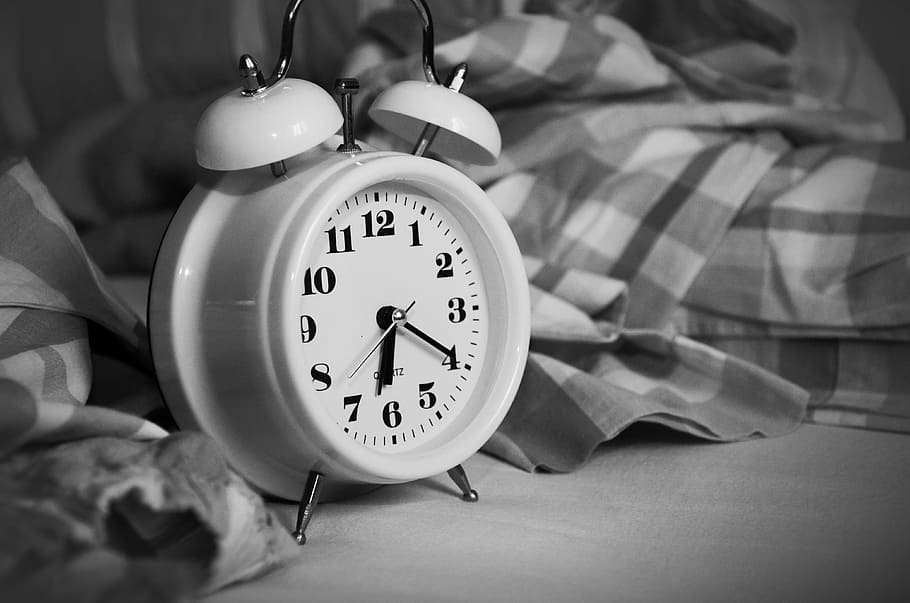 grey scale photo of alarm clock, stand up, time of, sleep, bed