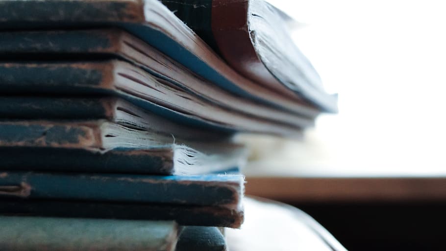 stacked blue notebooks, close up photo of blue and white books HD wallpaper