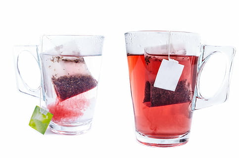 two red tea in mugs, cup, white, teabag, glass, close-up, isolated HD wallpaper