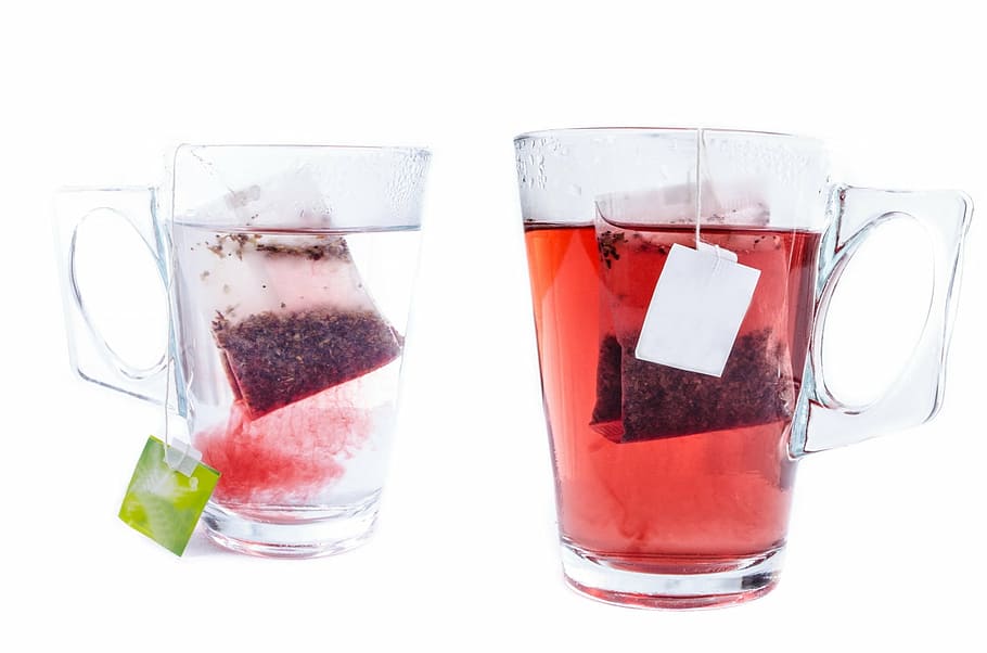 two red tea in mugs, cup, white, teabag, glass, close-up, isolated HD wallpaper
