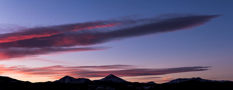 mountain ranges under clouds, landscape photography of a mountain during golden hour HD wallpaper
