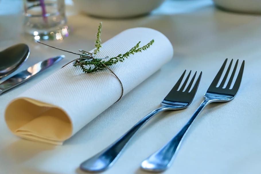 two gray stainless steel forks beside white table napkin, silver HD wallpaper