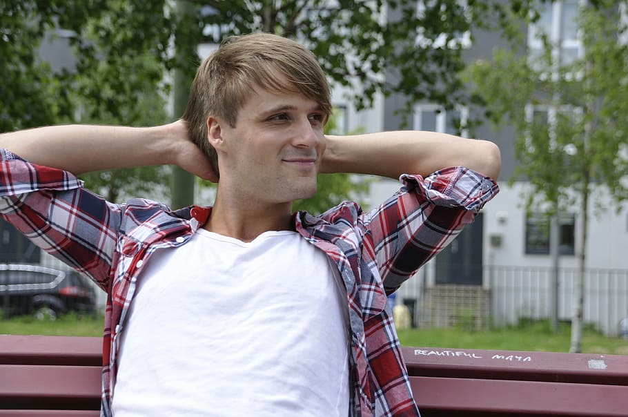 man sitting on a bench with both hands on head, model, boy HD wallpaper