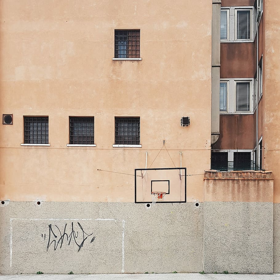 architectural photography of brown concrete building, photo of black and red basketball hoop HD wallpaper