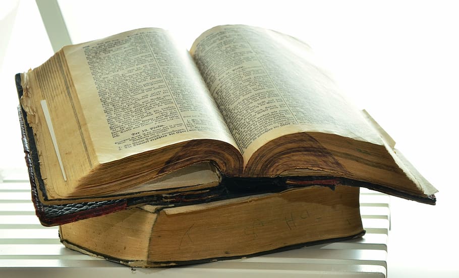 black hardbound book, bible, old bible, historically, christianity