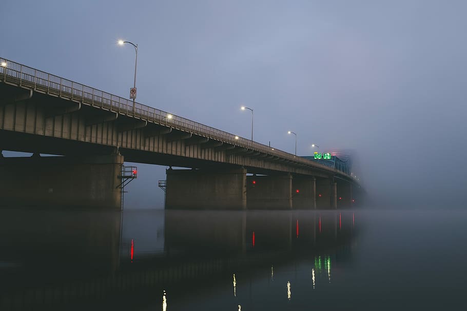 bridge covered with thick fog during daytime, low angle view of concrete bridge over body of water with fogs, HD wallpaper